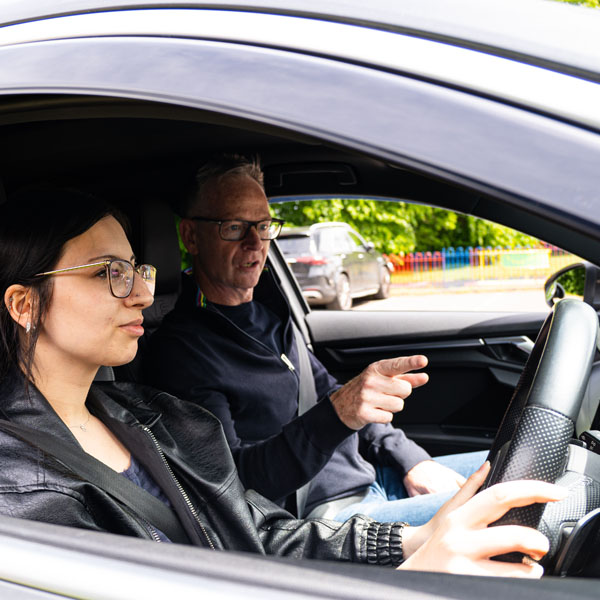 StreetSafe Driving School student driver taking a behind-the-wheel lesson with a StreetSafe Driving School instructor