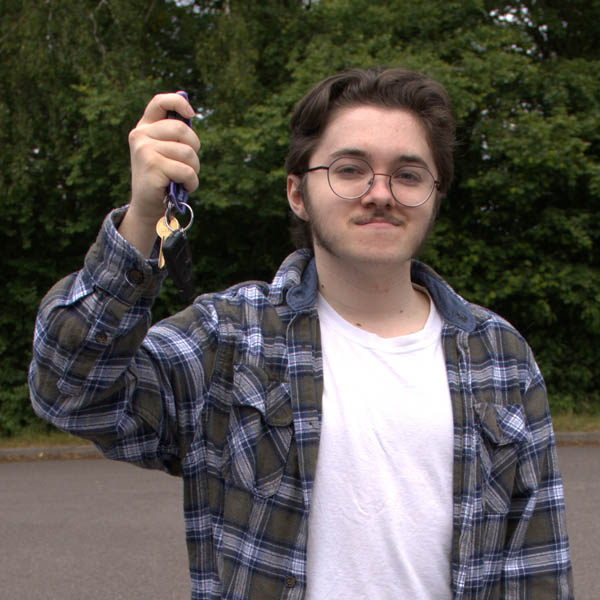 student holding car keys